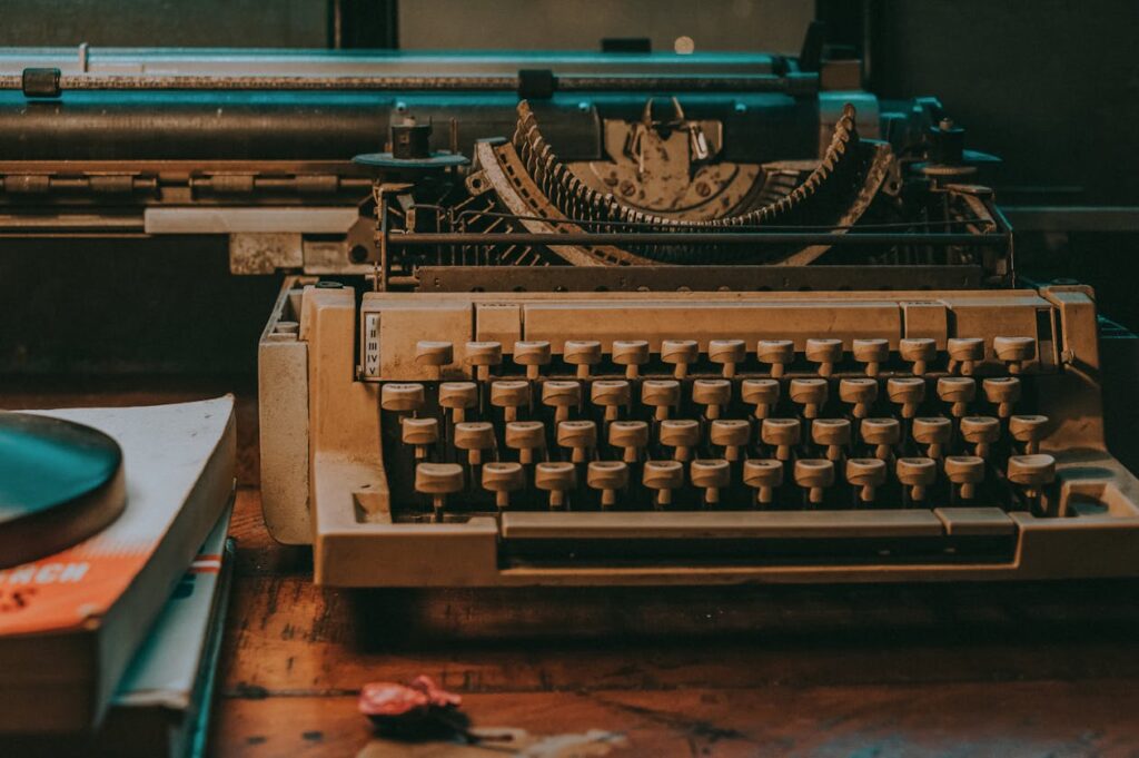 Vintage typewriter on a wooden desk evoking cozy mystery writing