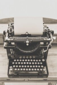 Vintage typewriter symbolizing the show don't tell writing craft