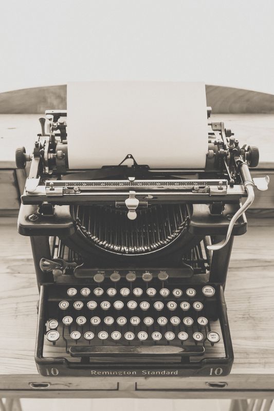 Vintage typewriter symbolizing the show don't tell writing craft